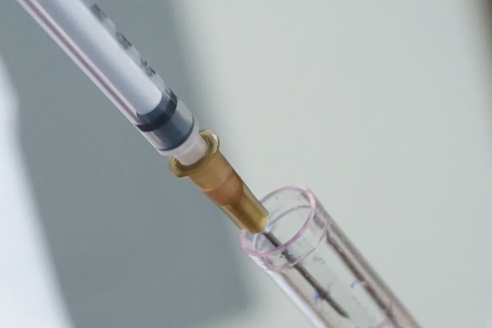 mrna-vaccine-syringe-solution-tight-shot-medicine-lab