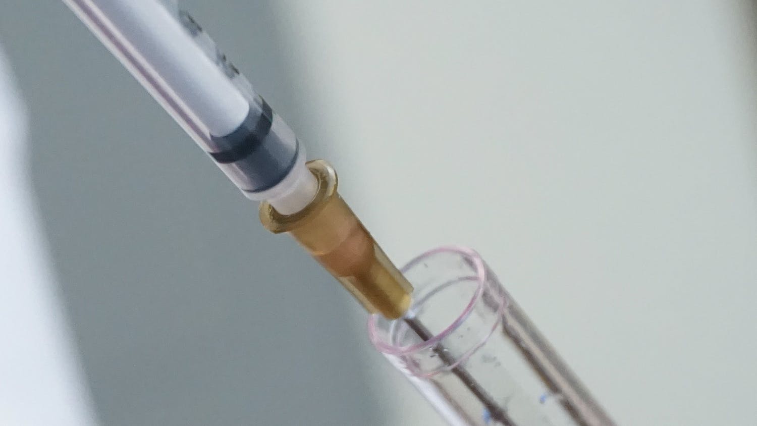 mRNA vaccine syringe solution tight shot medicine lab.jpg