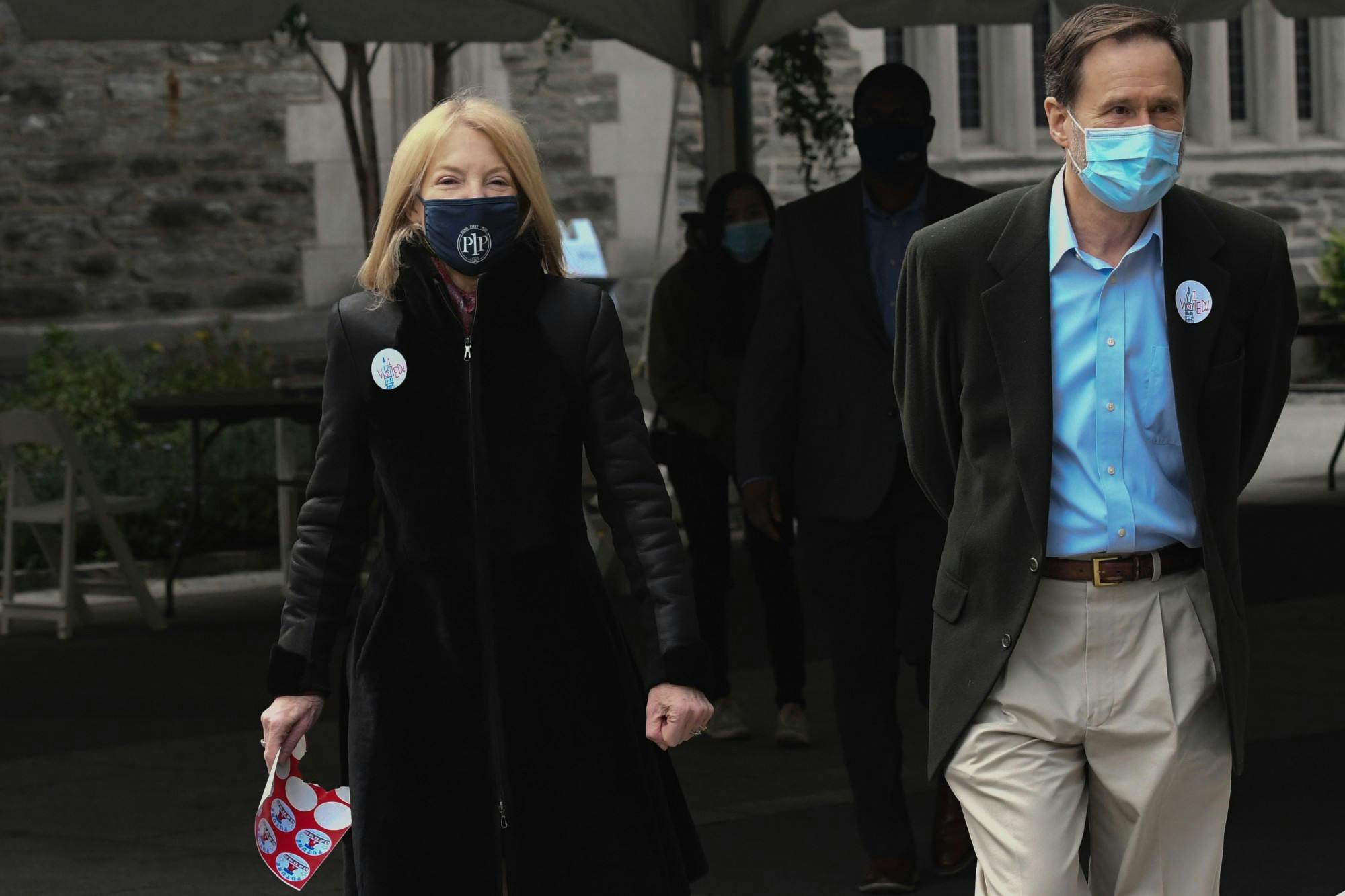 Amy Gutmann and Husband Voting Stickers Election Day.jpg