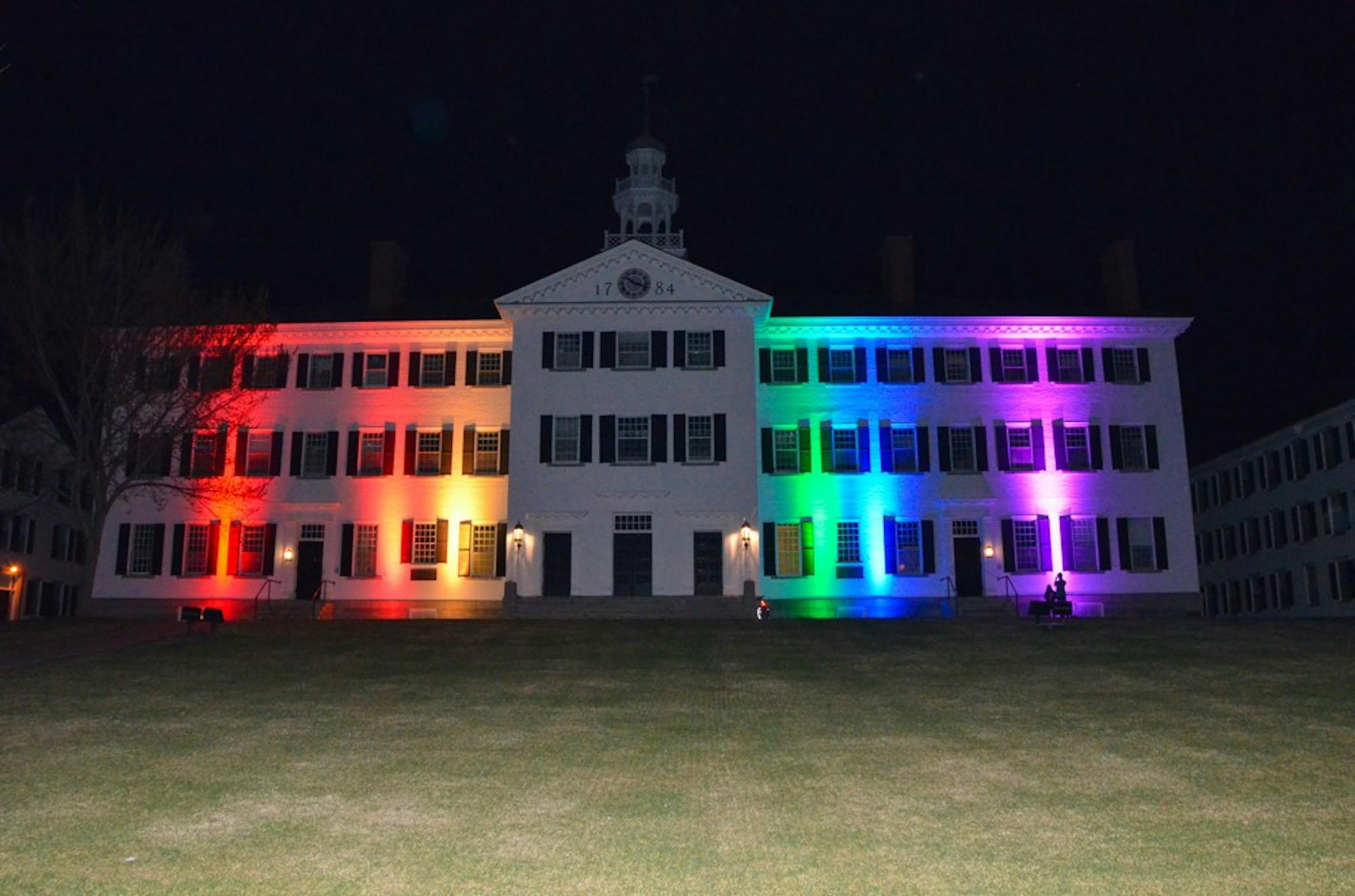 Dartmouth Hall lights up in rainbow in honor of PRIDE.