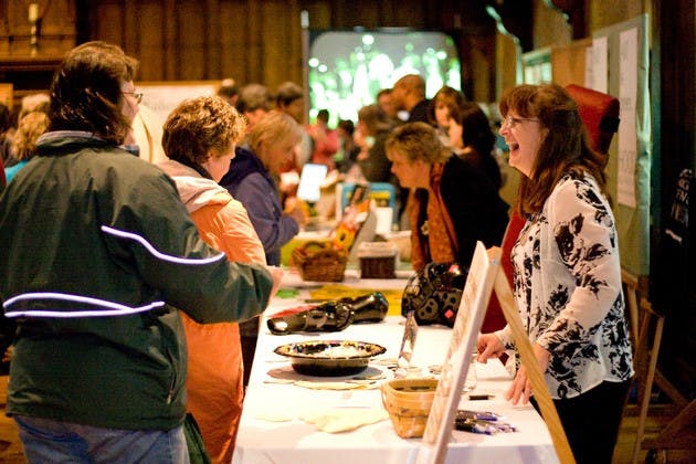 College employees visit booths at the Fall Employee fair in Collis Common Ground on Tuesday afternoon.