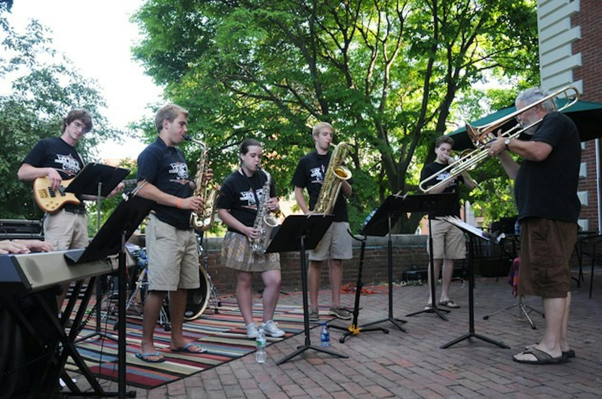 Members of the Barbary Coast, led by Donald Glasgo, perform on Collis Porch this summer.