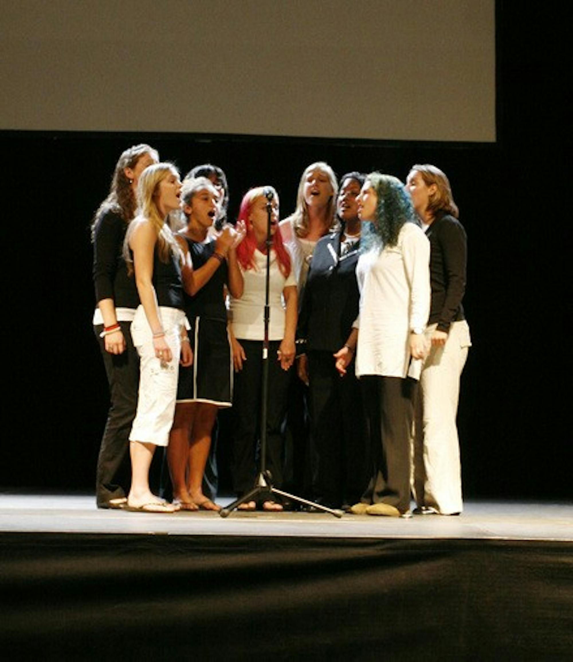 Dartmouth's women's a capella group for social justice, the Rockapellas, perform at an orientation event in Spaulding Auditorium.
