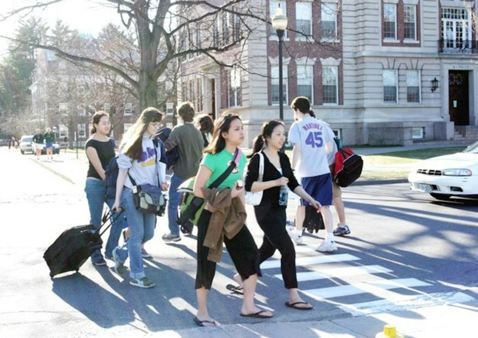 With suitcases in hand, prospective members of the Class of 2010 leave campus after a long weekend visiting the College.isiting