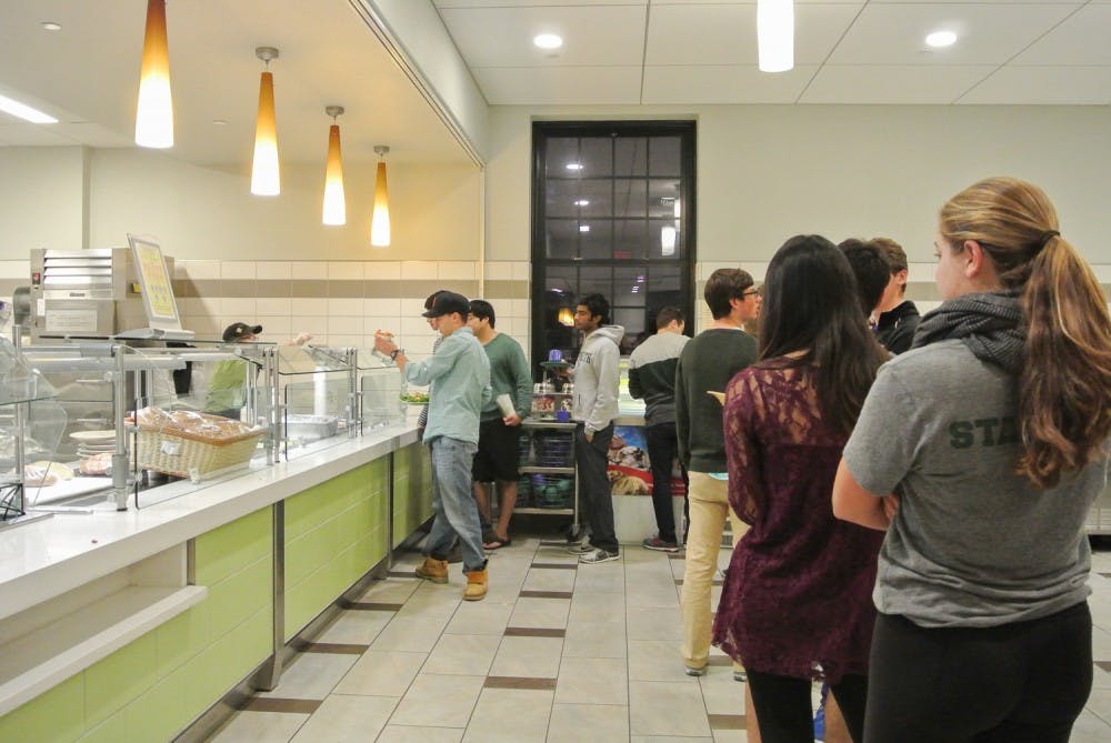 Students wait in line at the Pavilion section of the Class of 1953 Commons. 