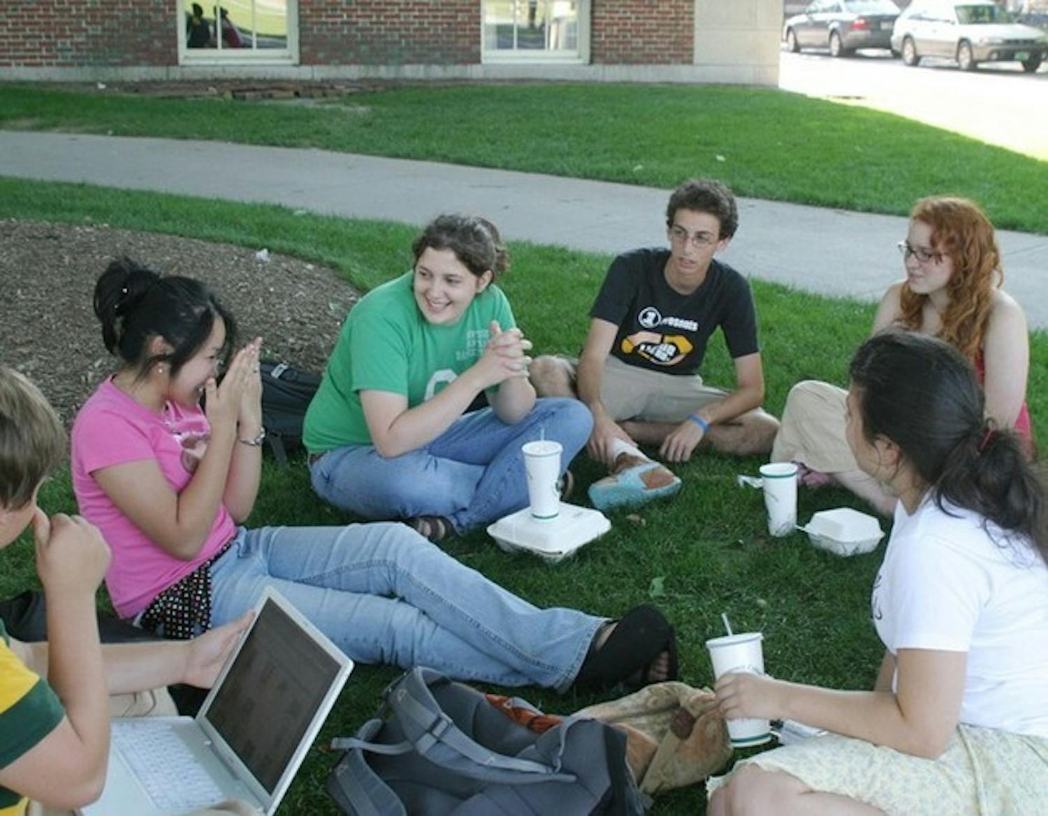 High school students attending the Dartmouth Debate Institute gather on the lawn of Robinson Hall Wednesday afternoon. Campers spend most of their time working and have little free time for partying or hanging out.