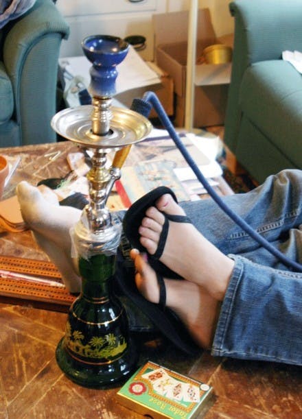 Students above enjoy a hookah, joining a rapidly growing population of Dartmouth students and Upper Valley residents who have made smoking sheesha more popular recently.