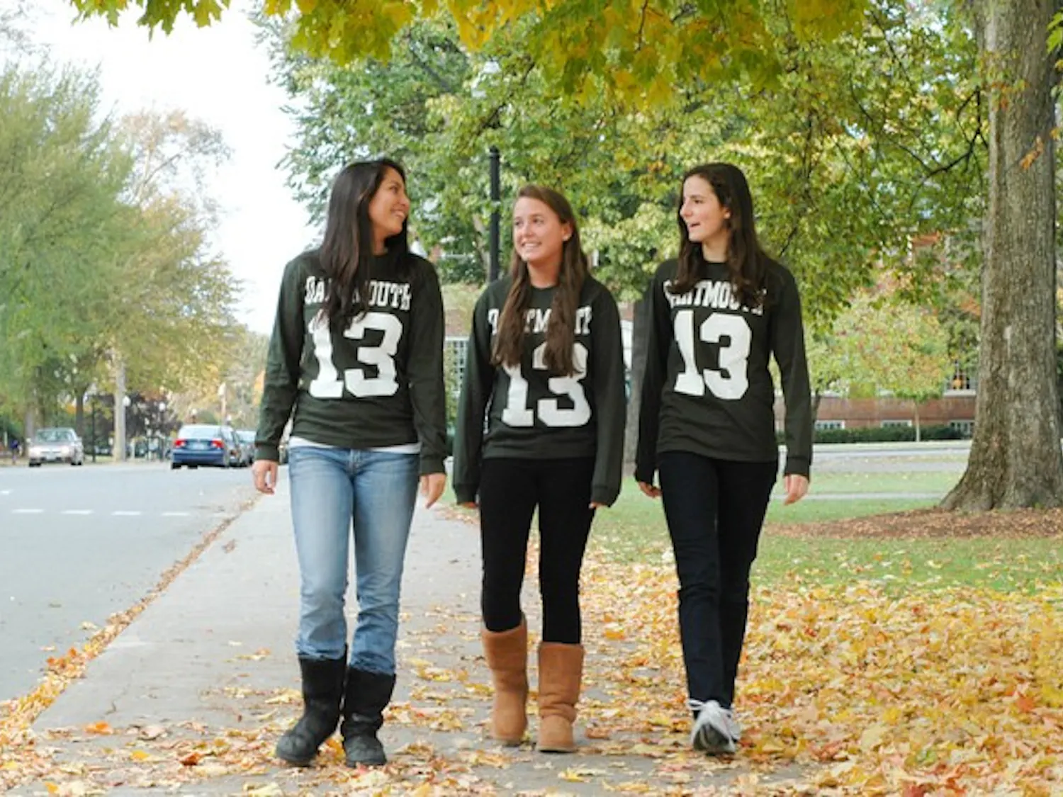 Chloe Gettinger '13, Whitney Bren '13 and Sophie Palitz '13 walk along the Green in their class shirts.