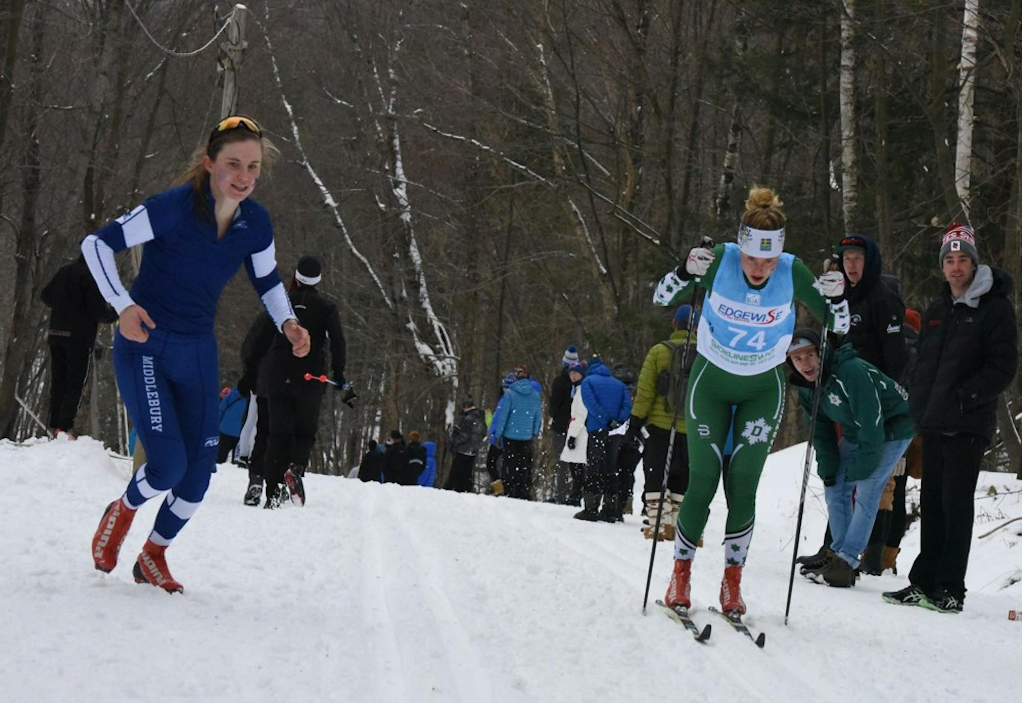Cate Brams (left), a senior at Middlebury College, cheers on younger sister Leah Brams ’20 (right) as she competes in a classic race.