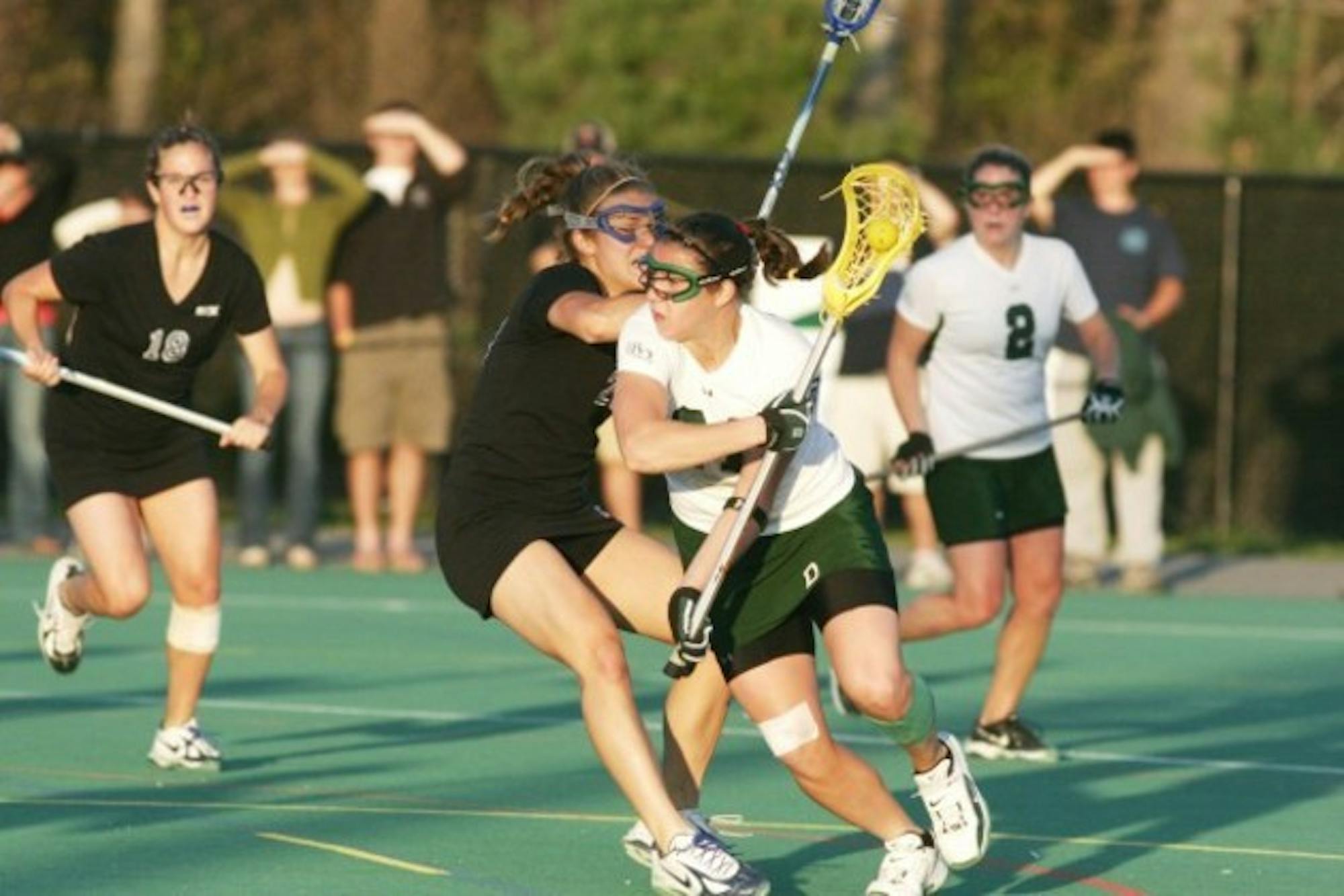 The women's lacrosse team, which finished 14-6-0 overall last year, will welcome eight recruits in the fall.