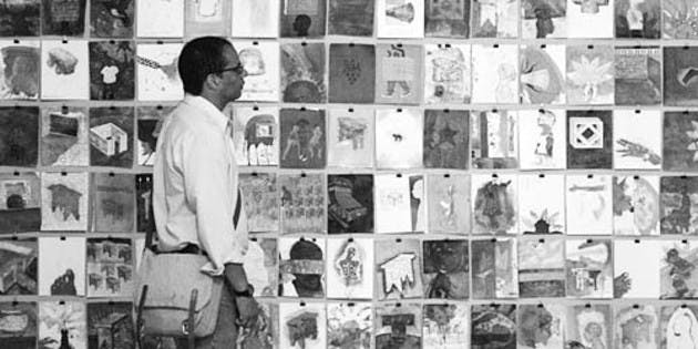 Artist Christopher Cozier views one of his own installations in the the Hop's Jaffe-Friede Gallery. His artwork often examines mixed-race identities.