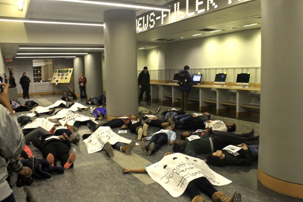 About 40 students staged a "die-in" on First Floor Baker on Thursday Night.
