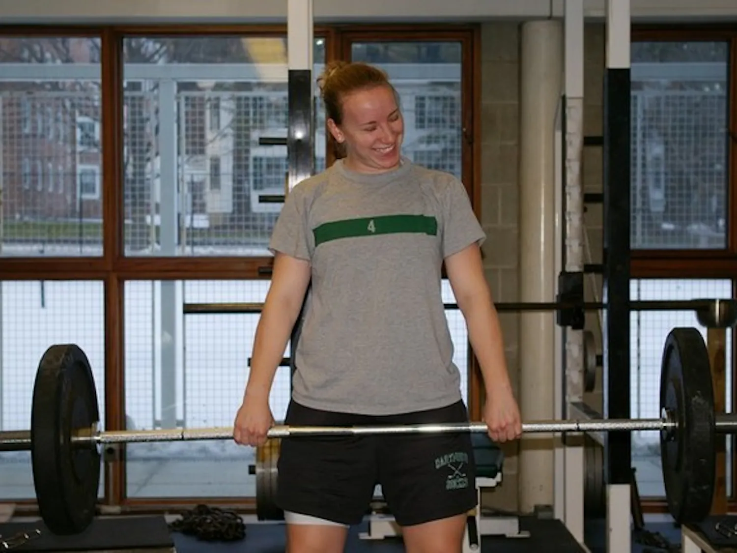Meredith Batcheller '07, a defenseman on the women's hockey team, lifts weights at a winter workout.