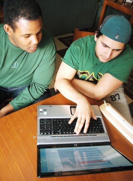 Omar ElNaggar '07 and Lucius Alexander '07 work on sound clip website Entertonement.com, which they founded along with three Dartmouth alumni.