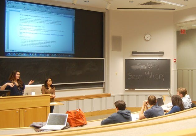 Student Assembly members begin a long-term discussion on the College's planned budget cuts at their weekly meeting Wednesday night.