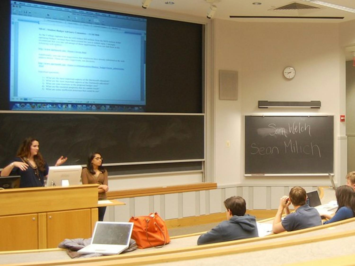 Student Assembly members begin a long-term discussion on the College's planned budget cuts at their weekly meeting Wednesday night.