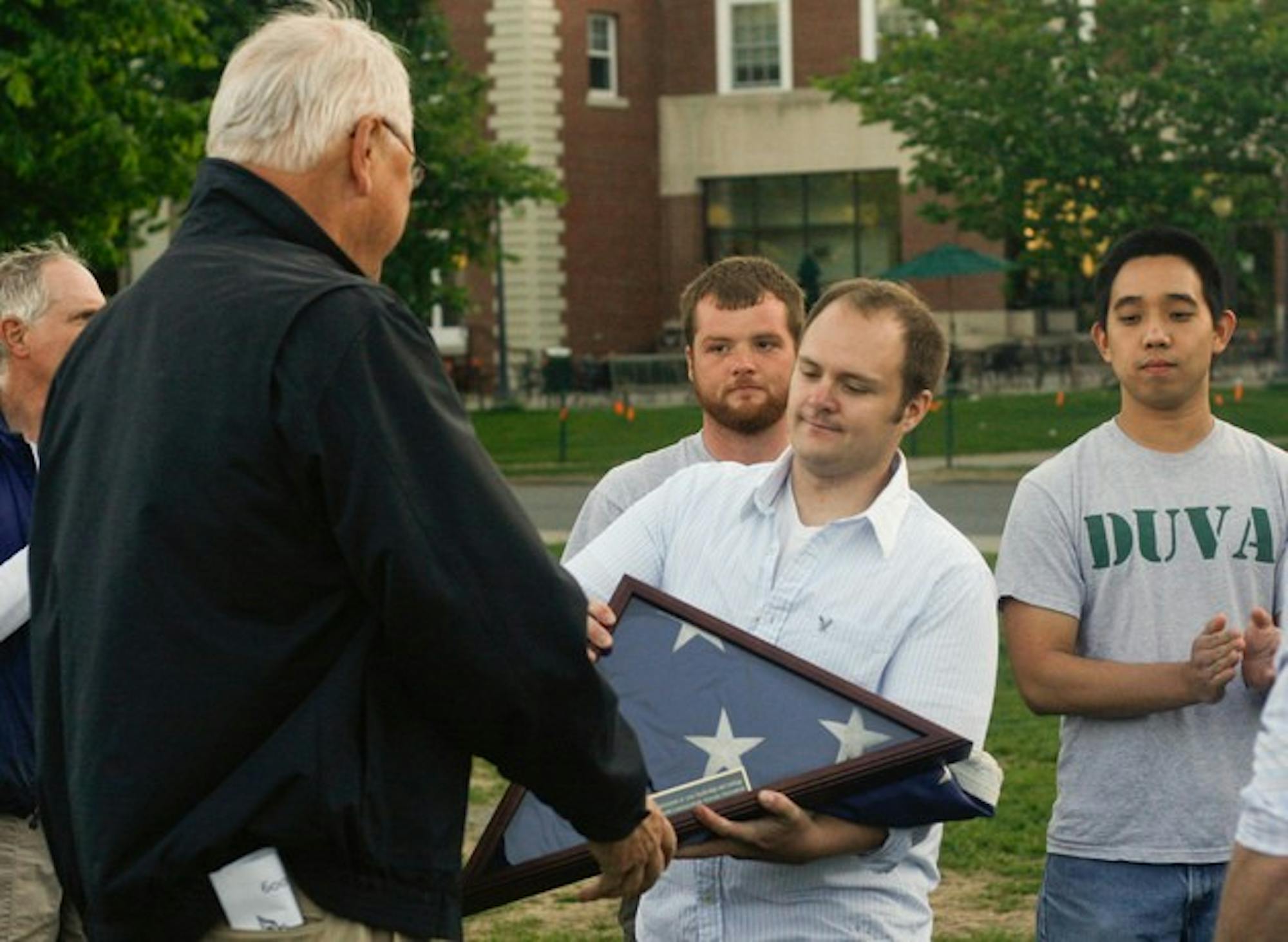 College President James Wright was presented with an American flag at the conclusion of a Memorial Day ceremony on Monday.