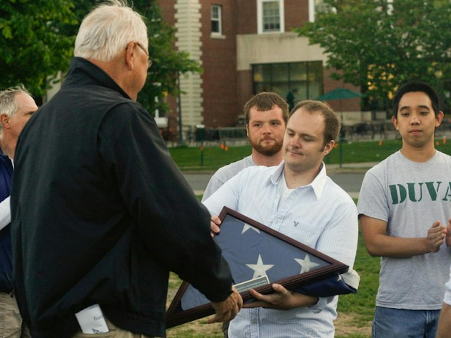 College President James Wright was presented with an American flag at the conclusion of a Memorial Day ceremony on Monday.