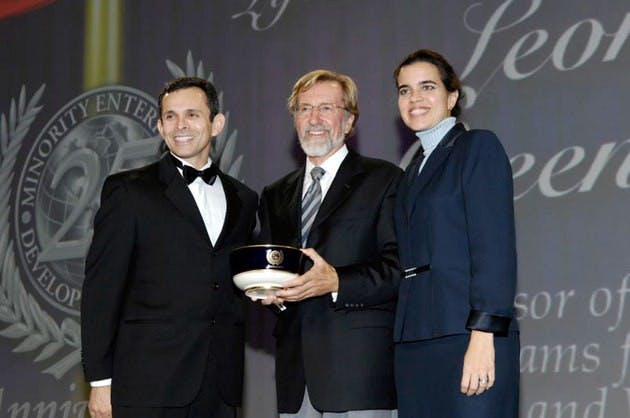 Professor Leonard Greenhalgh, center, was recently awarded for his work with the Minority- and Women-Owned Business Enterprises program