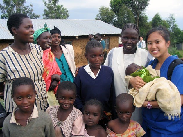Dartmouth Medical School student Leslie Claracay holds a child in the rural village of Tuikut, in Kenya. So far, the volunteers have raised $13,000 for the health clinic through a letter-writing campaign.