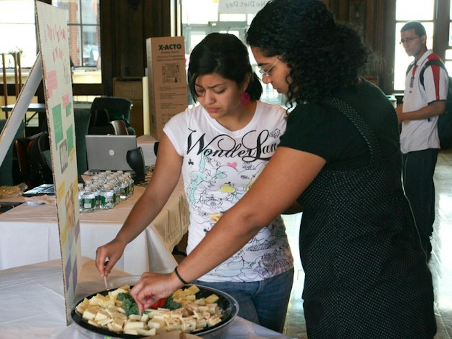 Students indulge in their favorite foods for 'No Diet Day,' an international event to raise awareness about potential hazards of dieting.