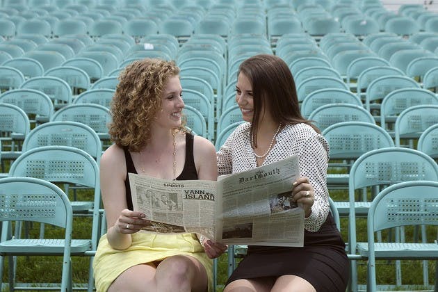Emma Fidel '12 and Alina Everett '12, editor-in-chief and publisher emerita, read a copy of The D one last time before Commencement.