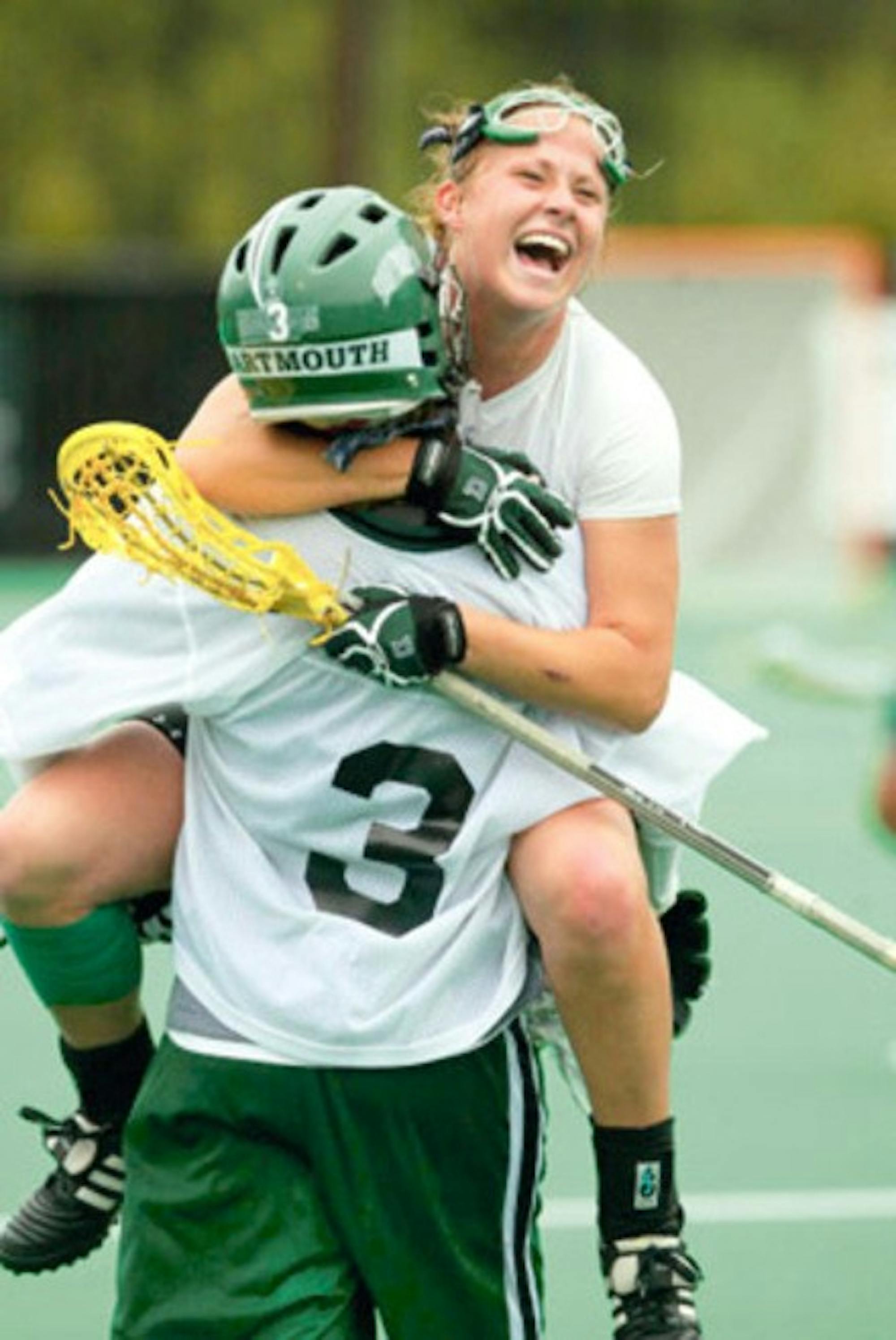 Whitney Douthett '07 jumps into the arms of teammate Devon Wills '06. Both former Big Green athletes have been named to the U.S. National Team.