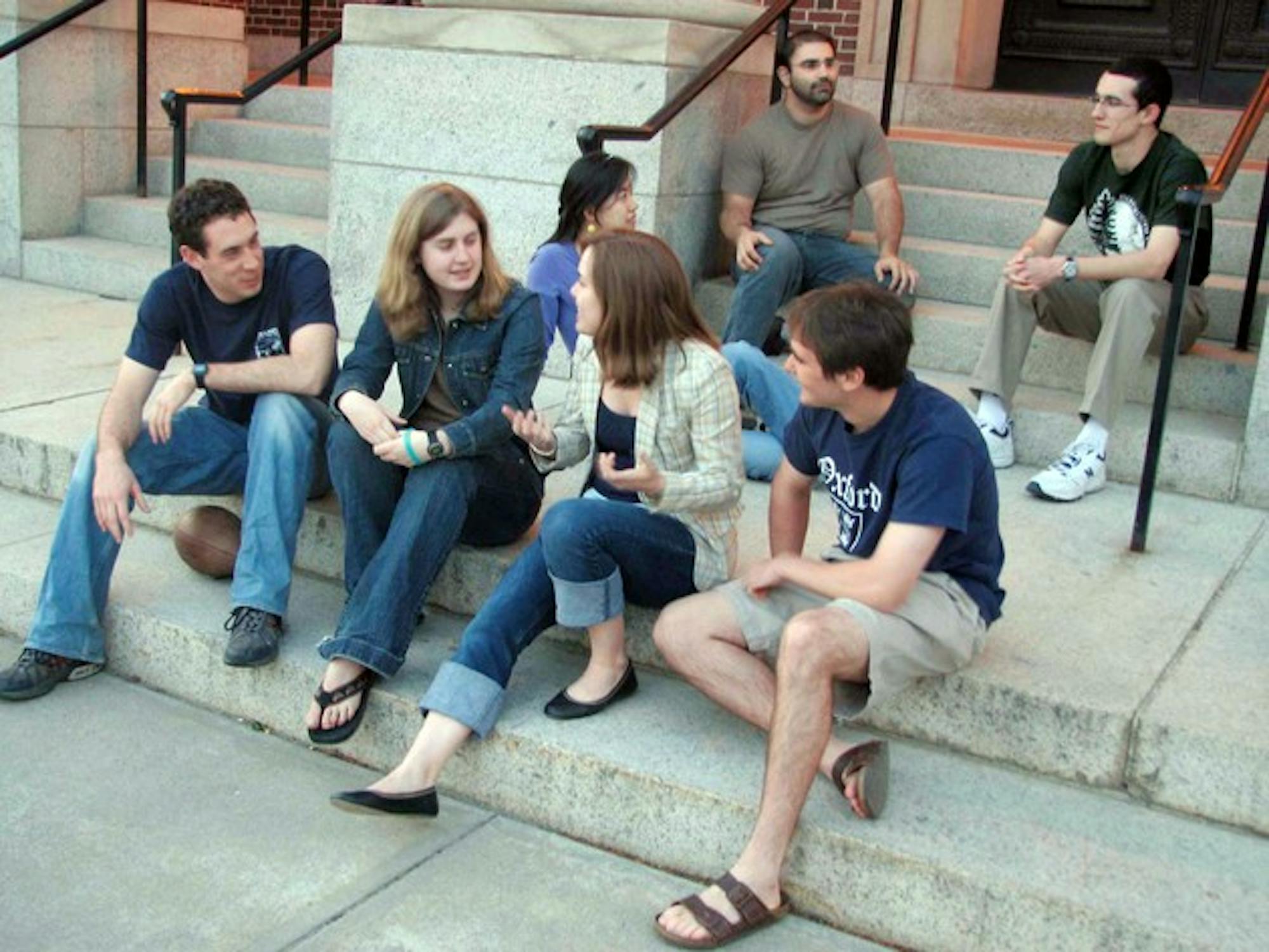 Staffers of new Christian-intellectual campus journal Apologia meet for an editorial gathering on the steps of Rauner Library.