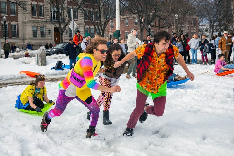 Students donned flair to participate in Winter Carnival events like the human dog sled race.