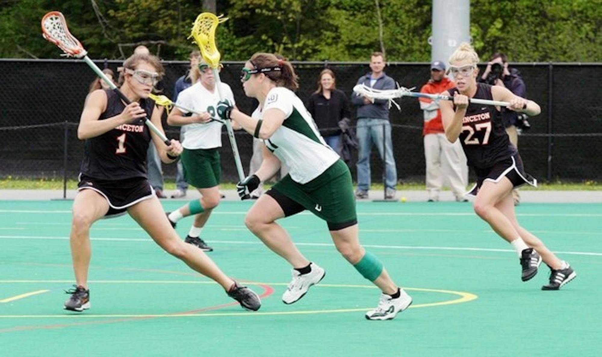 Jen Pittman '07 (pictured above) netted three goals to lead the Big Green to a thrilling 7-6 victory Saturday.