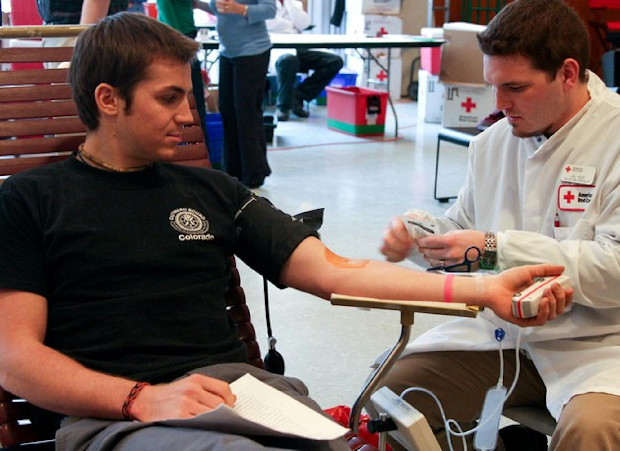 Nat Grainger '08 donates blood at the annual Blood Drive at The Hop on Wednesday.