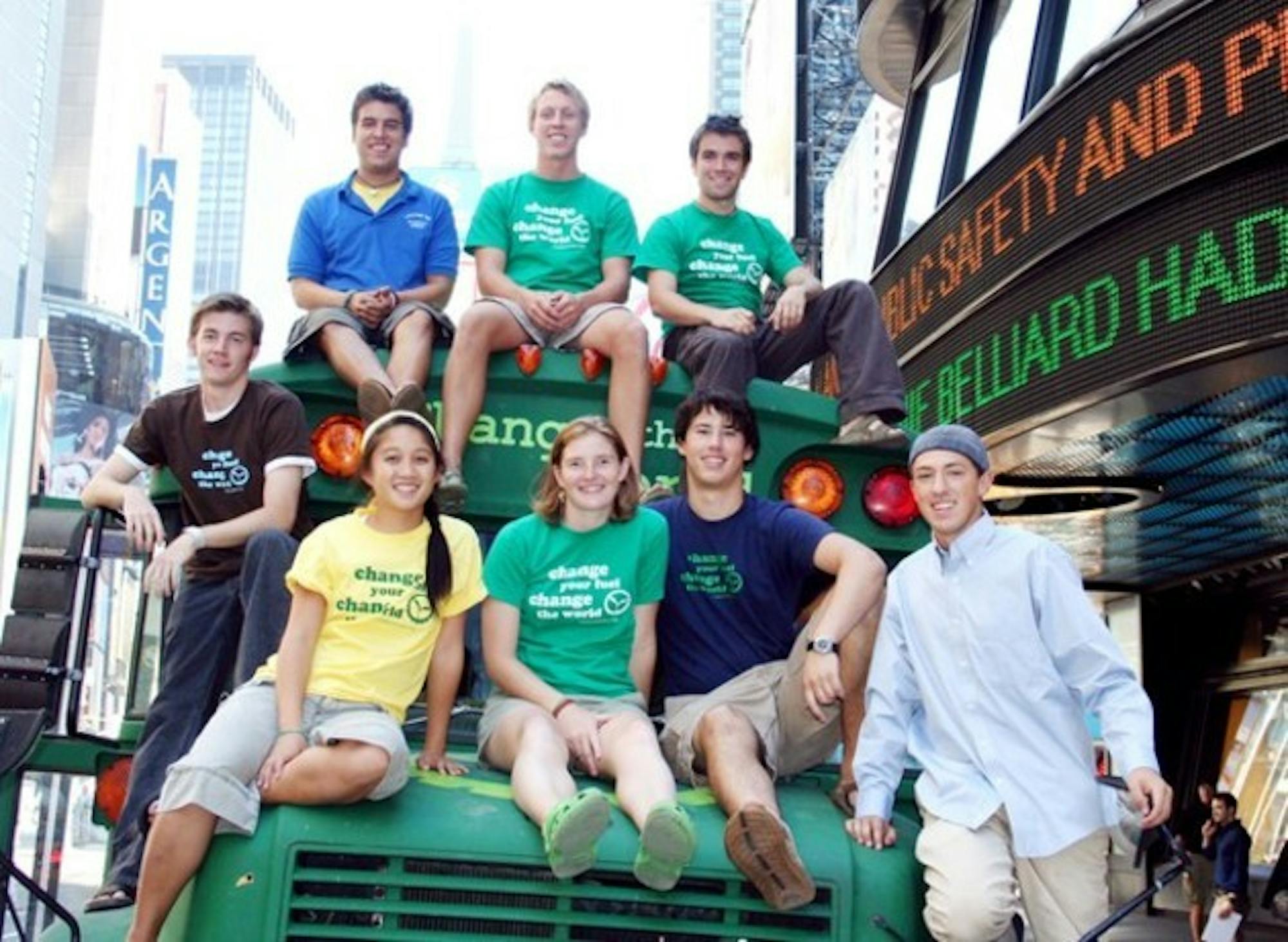 Students accompanying the Big Green Bus pause in Times Square, one of about 50 stops nationwide, to pose with their vegetable-oil powered vehicle.