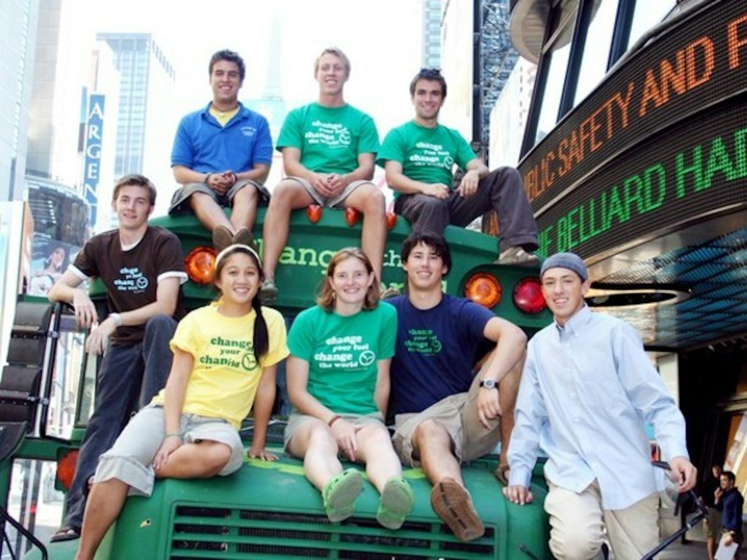 Students accompanying the Big Green Bus pause in Times Square, one of about 50 stops nationwide, to pose with their vegetable-oil powered vehicle.