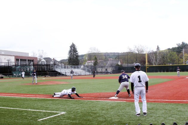 Dartmouth shortstop Joe Sclafani '12 dives into first base during a 5-3 Big Green win over Quinnipiac University on Tuesday.
