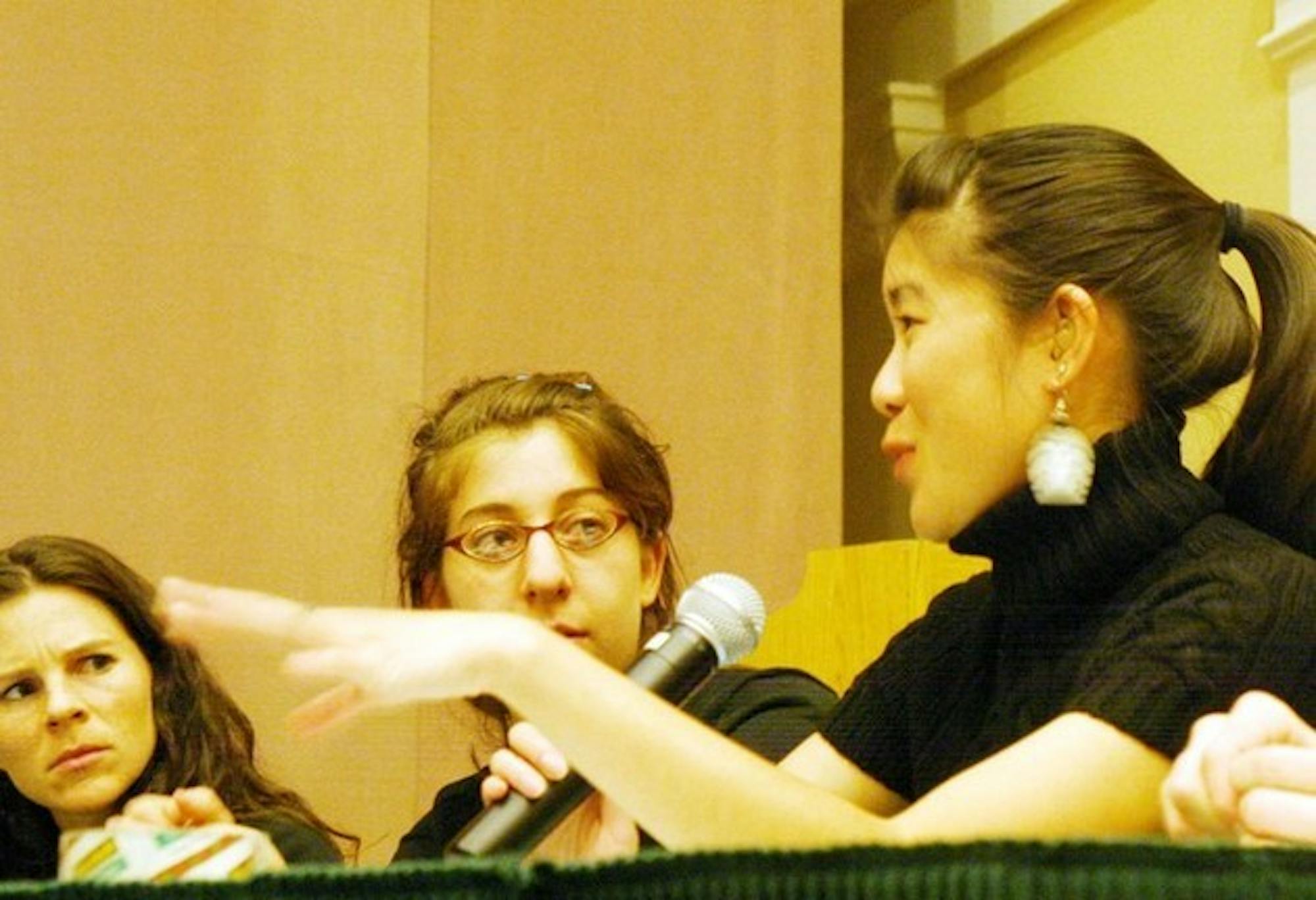 Community director Angela D'Amour, Rena Fried '08 and Kristen Wong '06 participate in a reenactment of a COS hearing as part of Sexual Abuse Awareness Week.