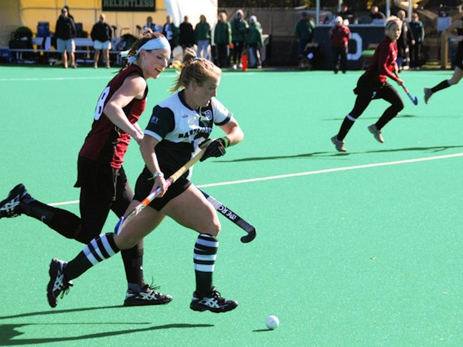 Captain Ashley '09 blows by a Harvard defender as the Big Green shutout the Crimson, 1-0 on Saturday.