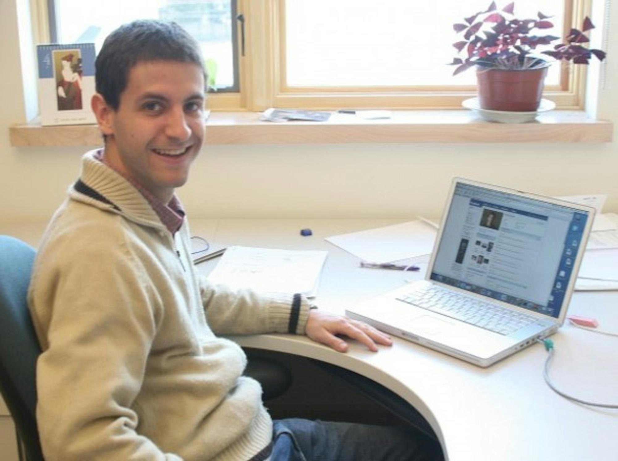 Mathematics professor Sergi Elizalde checks out his Facebook profile from his office. Elizalde has 42 Dartmouth 