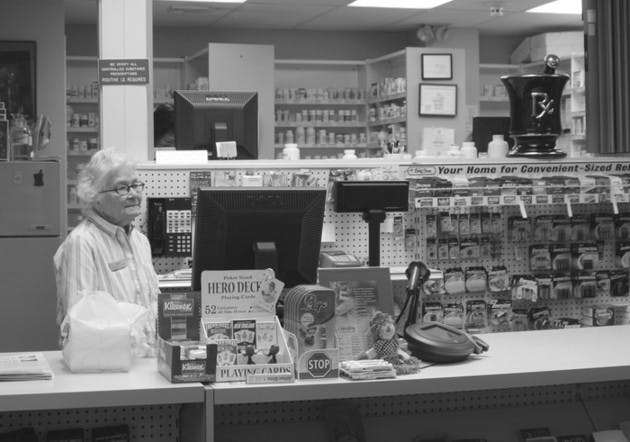 Pharmacist Melissa Knight works behind the counter at the Health Services pharmacy, where a prescription is still required for the Plan B pill.