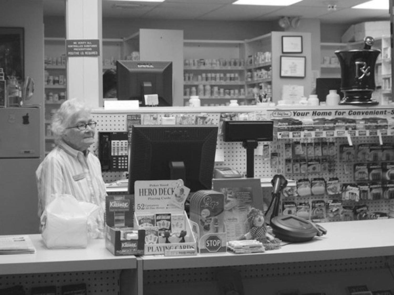 Pharmacist Melissa Knight works behind the counter at the Health Services pharmacy, where a prescription is still required for the Plan B pill.