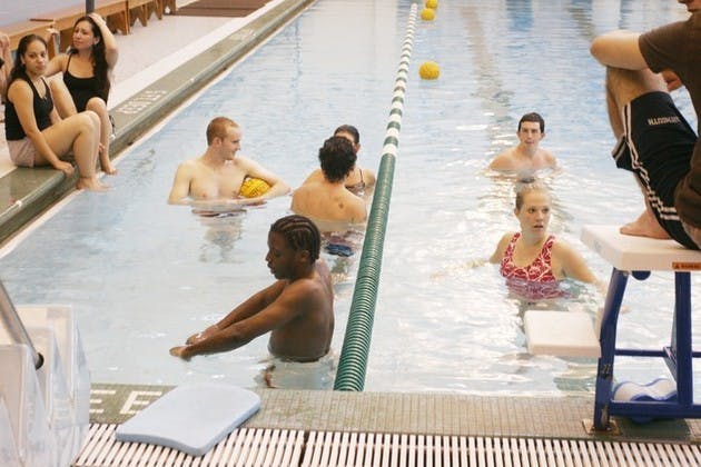 SEAD mentees listen to brothers of Phi Delta Alpha fraternity ruminate on college life at a barbecue sponsored by the fraternity on Monday.