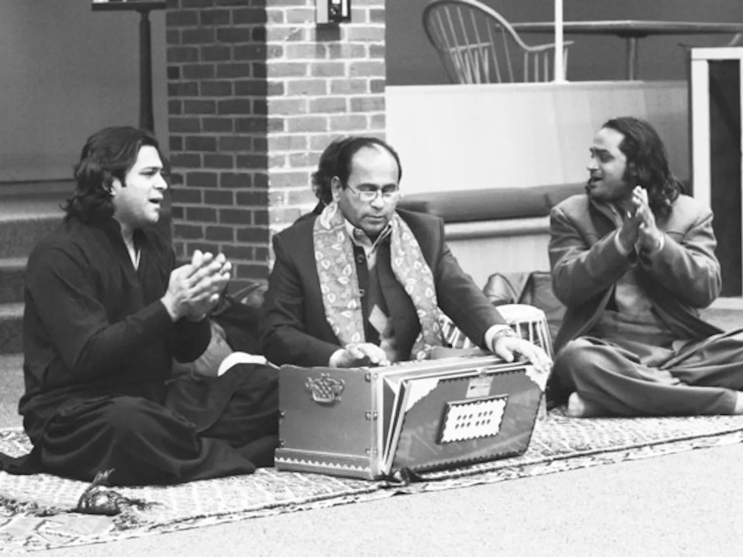 The Qawwali Masters, a musical group from Pakistan, eat dinner with students after a show in Brace Commons.