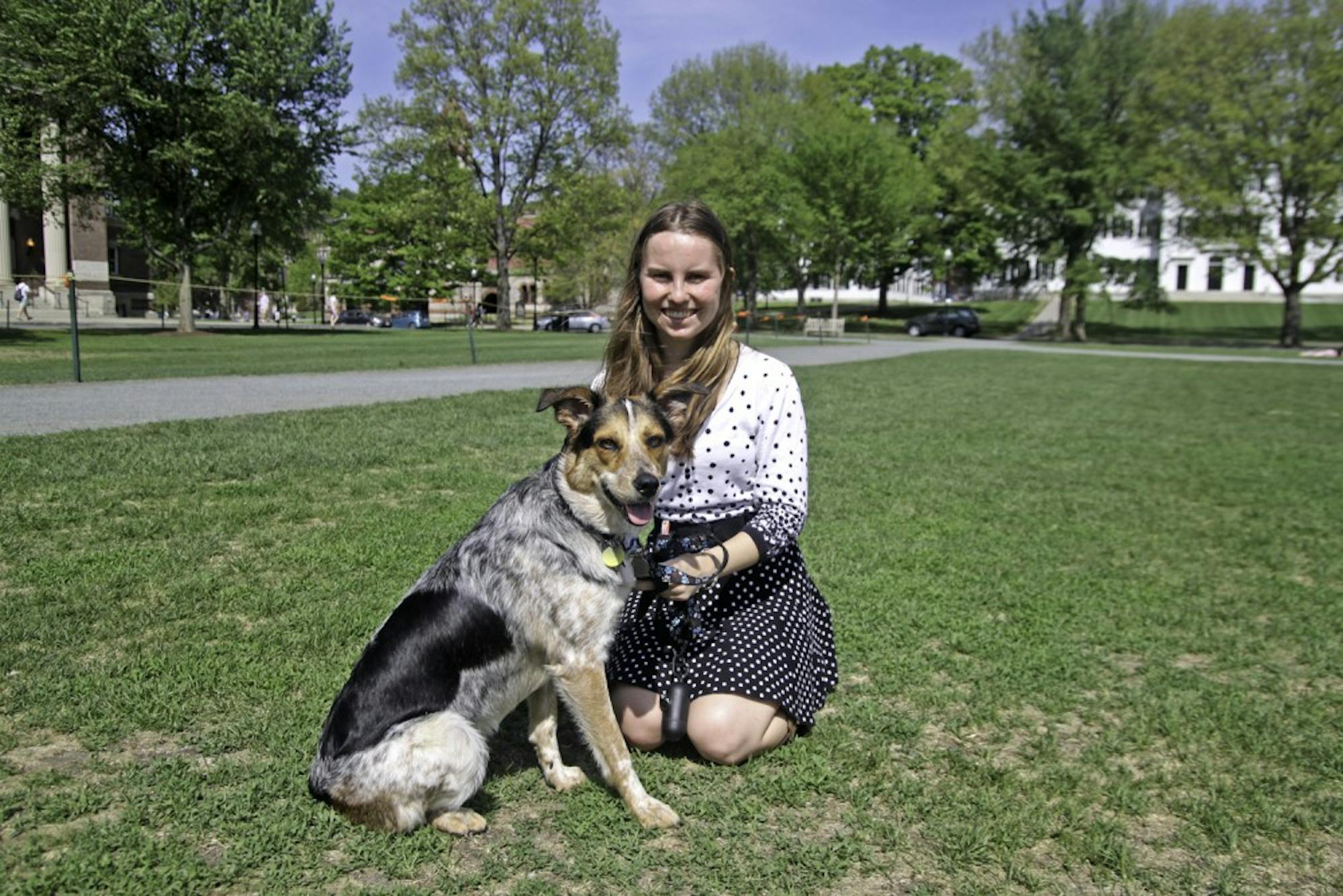 Allie Fudge '18 hangs out with her support dog, Kelsie Iris, on the Green.