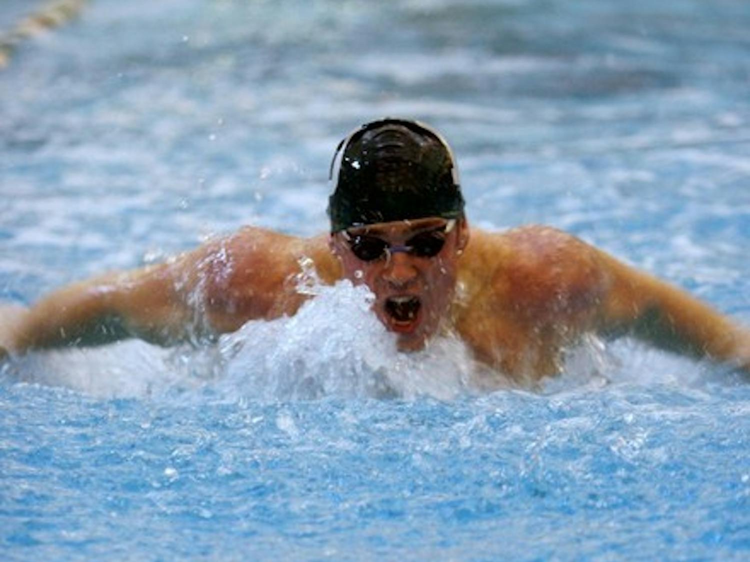 The swimming and diving programs dominated Maine on Sunday.