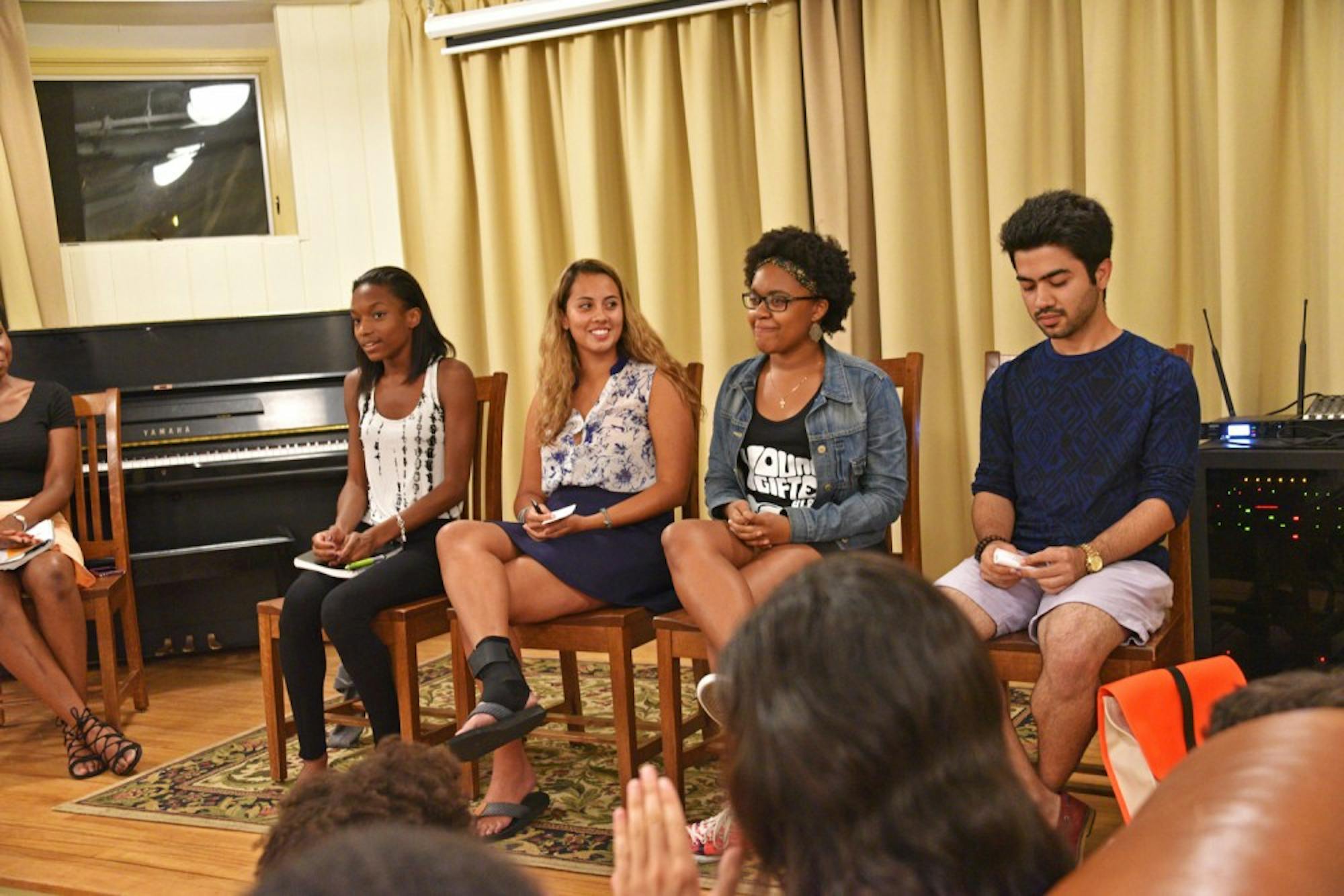 Four panelists speak on a Tuesday panel about race in the Greek system as part of the “VoX: Voices of Summer.”