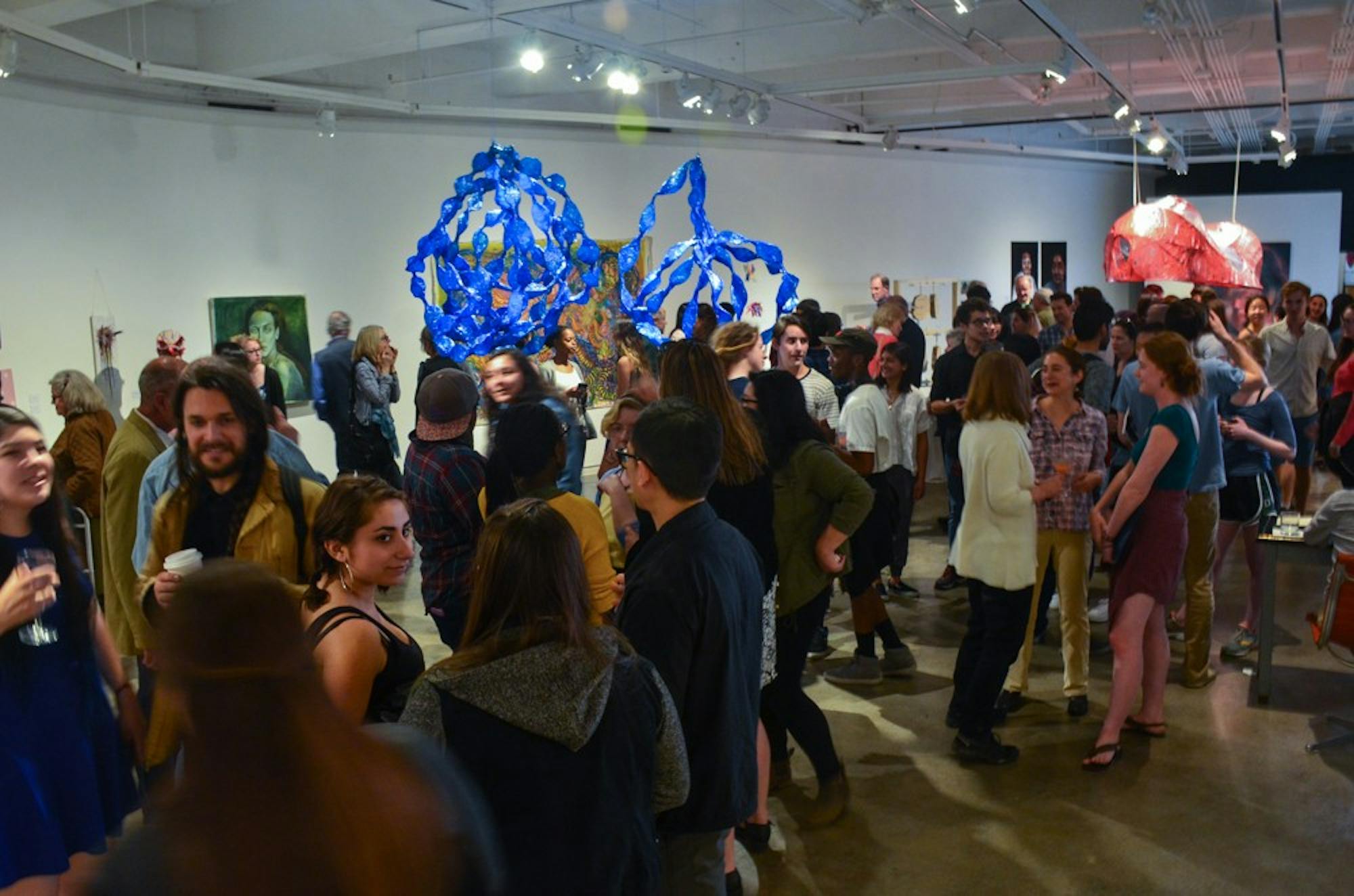 Many students and faculty members attended the opening reception of the studio art department’s senior majors exhibition.