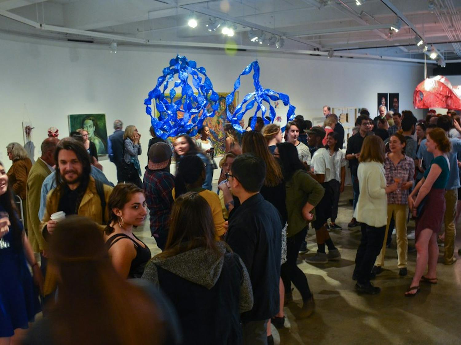 Many students and faculty members attended the opening reception of the studio art department’s senior majors exhibition.