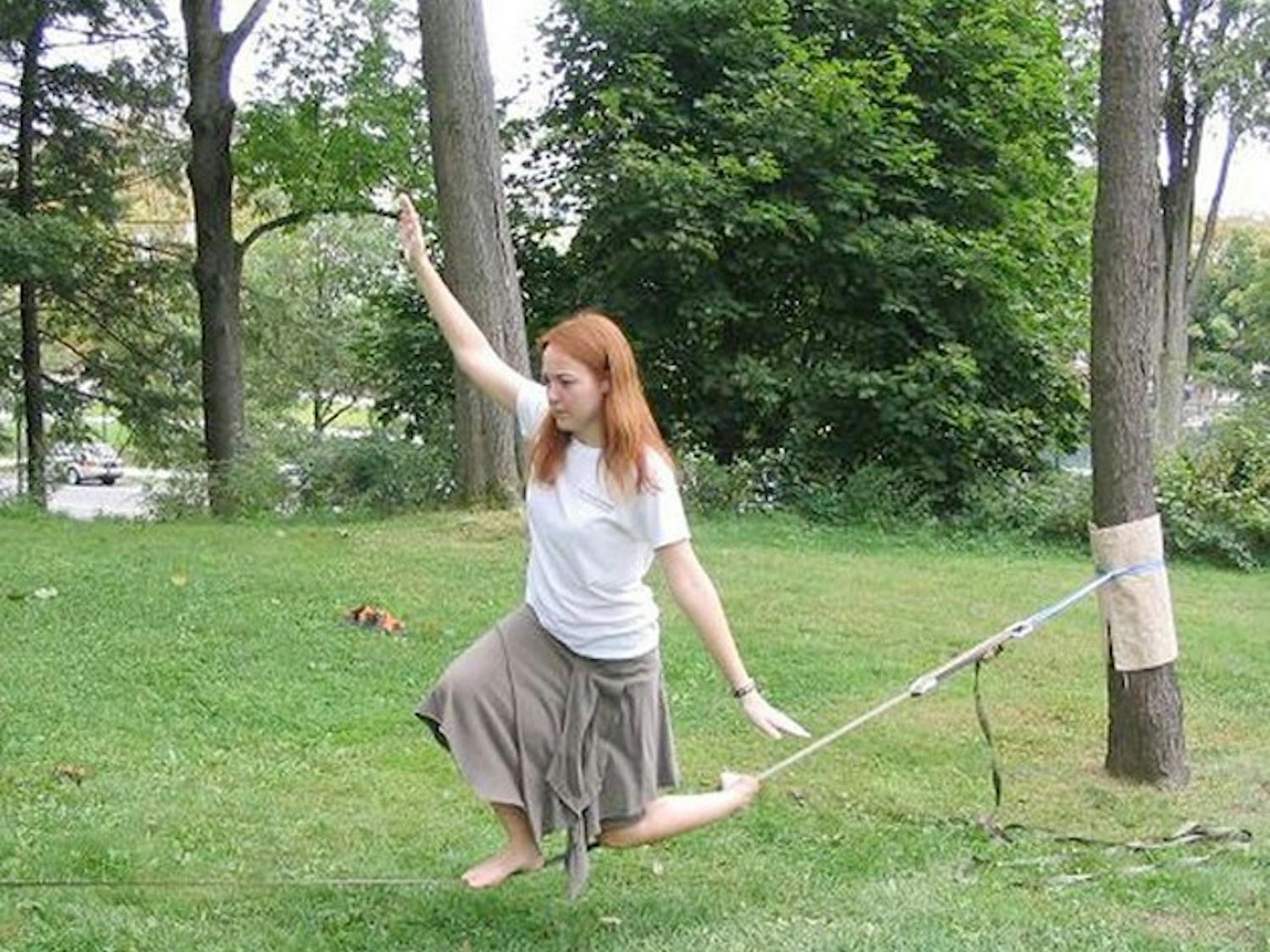 Meghan Mella GR'11 is one of the two graduate students at Dartmouth who can be seen practicing the unique sport of slacklining around the campus.