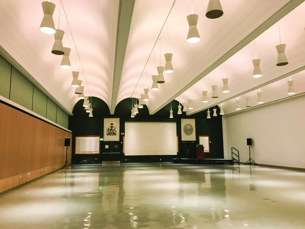 Over 150 people attended Monday's faculty of arts and sciences meeting in Alumni Hall, including around 50 protesters&nbsp;supporting Native American studies professor N. Bruce Duthu '80's appointment as dean of the faculty.