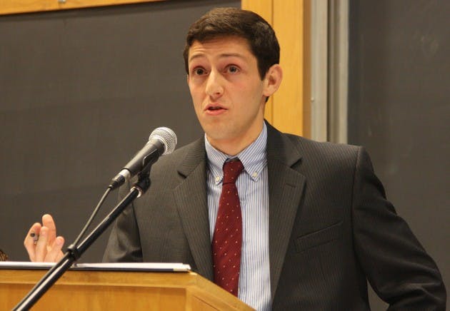 Greg Boguslavsky '09, chair of the New Hampshire College Republicans, pushes the Republican presidential platform against the College Democrats.