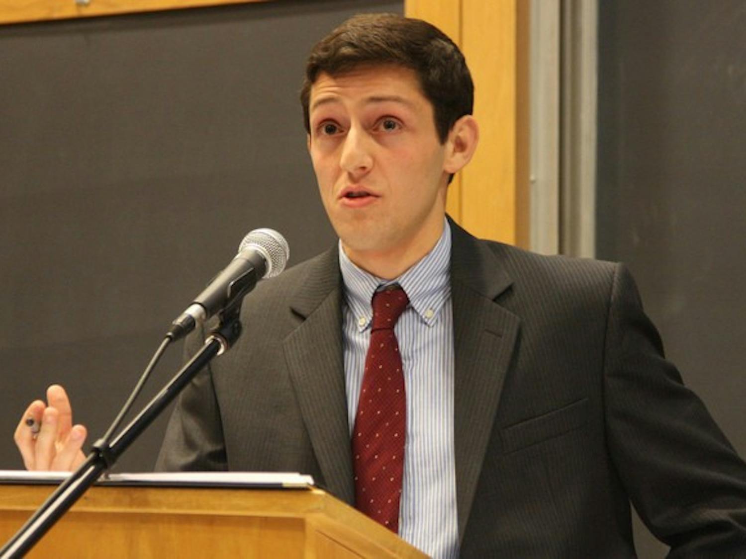 Greg Boguslavsky '09, chair of the New Hampshire College Republicans, pushes the Republican presidential platform against the College Democrats.